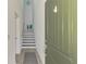 Inviting entryway featuring tile floors and stairs leading to the upper level at 10213 Staggerbush Dr # 202, Venice, FL 34293