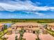 Beautiful townhouse with a red brick driveway, three garage spaces, and scenic views at 10213 Staggerbush Dr # 202, Venice, FL 34293