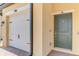 A well lit garage and front door, ready to welcome you to the property at 10213 Staggerbush Dr # 202, Venice, FL 34293
