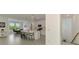 Bright, open-concept kitchen features an island with seating, stainless steel appliances, and easy access to the dining area at 10213 Staggerbush Dr # 202, Venice, FL 34293