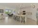 Spacious kitchen with island seating, modern appliances, and an open layout connecting to the dining area at 10213 Staggerbush Dr # 202, Venice, FL 34293