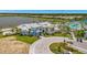 Aerial view of the community amenities, including the Waterline building, pool, and waterfront at 10367 Abaco Falls Dr, Englewood, FL 34223