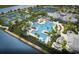 Aerial view of community pool, tennis courts, and clubhouse surrounded by mature trees at 10367 Abaco Falls Dr, Englewood, FL 34223
