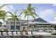 Resort-style clubhouse with lounge chairs, tables, and beautiful landscaping provides an oasis for residents at 10367 Abaco Falls Dr, Englewood, FL 34223