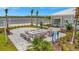 Outdoor fire pit area with comfortable seating and string lights, perfect for evening gatherings at 10367 Abaco Falls Dr, Englewood, FL 34223