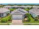 Charming single-story home with a two-car garage and beautifully landscaped front yard at 10367 Abaco Falls Dr, Englewood, FL 34223