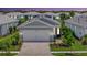 Charming single-story home with a two-car garage, paver driveway, and beautifully landscaped front yard at 10367 Abaco Falls Dr, Englewood, FL 34223