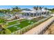 High Tide Bar & Grill featuring cornhole and outdoor games, lush landscaping and patio seating at 10367 Abaco Falls Dr, Englewood, FL 34223