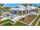 Outdoor dining area with ample seating and lush landscaping at the High Tide Bar & Grill at 10367 Abaco Falls Dr, Englewood, FL 34223