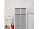 White laundry sink with storage unit for organizing cleaning and laundry supplies at 10367 Abaco Falls Dr, Englewood, FL 34223