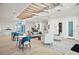 An open lobby with modern light fixtures, wood floors, and seating area at 10367 Abaco Falls Dr, Englewood, FL 34223