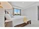 Bright main bedroom with tray ceiling and view of backyard at 10367 Abaco Falls Dr, Englewood, FL 34223