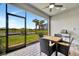 Screened patio perfect for outdoor dining while enjoying views of the lake and landscaping at 10367 Abaco Falls Dr, Englewood, FL 34223