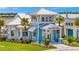 Exterior view of the Waterline building, showcasing its coastal design and landscaping at 10367 Abaco Falls Dr, Englewood, FL 34223