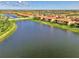 Scenic aerial shot of a residential area with lakeside homes, offering a tranquil setting at 10789 Tarflower Dr # 202, Venice, FL 34293