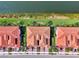 Overhead view of residences featuring tile roofs, manicured lawns and stunning lakefront property at 10789 Tarflower Dr # 202, Venice, FL 34293