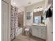 Well-lit bathroom with shower-tub combination, vanity, and coordinated decor at 10789 Tarflower Dr # 202, Venice, FL 34293