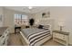 Serene bedroom with a decorative bed, desk, and natural light from a window at 10789 Tarflower Dr # 202, Venice, FL 34293