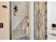 Charming entryway with decorative front door, tiled floor, and stairway at 10789 Tarflower Dr # 202, Venice, FL 34293