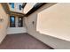 Inviting townhome entrance featuring a brick paver walkway and covered entryway at 10789 Tarflower Dr # 202, Venice, FL 34293