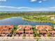 Lovely townhome features a tile roof, paver driveway, and water view at 10789 Tarflower Dr # 202, Venice, FL 34293