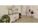 Inviting hallway with decorative mirror and console table adding charm to the home's entryway at 10789 Tarflower Dr # 202, Venice, FL 34293