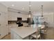 Bright kitchen features stainless steel appliances, a large island, and seamless flow to dining area at 10789 Tarflower Dr # 202, Venice, FL 34293