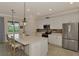Well-lit kitchen features stainless steel appliances, ample counter space, and a seamless design at 10789 Tarflower Dr # 202, Venice, FL 34293