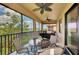 Spacious screened lanai with comfortable seating and a beautiful lake view at 10789 Tarflower Dr # 202, Venice, FL 34293