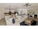 Spacious open-concept living space with a kitchen and seamlessly connected seating and dining areas at 10789 Tarflower Dr # 202, Venice, FL 34293