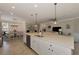 Open living space connecting the kitchen, dining, and living area with an abundance of natural light at 10789 Tarflower Dr # 202, Venice, FL 34293