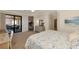 Inviting main bedroom boasts balcony access, seamless flow into the home, and stylish design elements for ultimate comfort at 10789 Tarflower Dr # 202, Venice, FL 34293