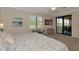 Bright main bedroom with scenic views, balcony access, and a serene atmosphere, creating an ideal sanctuary at 10789 Tarflower Dr # 202, Venice, FL 34293