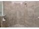 Close-up of the shower showcases stylish tilework and modern fixtures for a clean, contemporary look at 10789 Tarflower Dr # 202, Venice, FL 34293