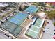 Aerial view of various courts including tennis, basketball, and shuffleboard, showcasing community recreational facilities at 1100 Tarpon Center Dr # 503 5C, Venice, FL 34285