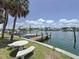 Waterfront home featuring a private boat dock, lush landscaping, and stunning views at 1100 Tarpon Center Dr # 503 5C, Venice, FL 34285