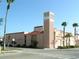 An attractive view of Venice Little Theater building with distinctive architecture and palm trees at 1100 Tarpon Center Dr # 503 5C, Venice, FL 34285