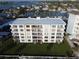 Bahia Mar condo building boasting balconies, manicured lawn, and well-maintained landscaping at 1100 Tarpon Center Dr # 503 5C, Venice, FL 34285