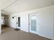 Hallway with two white doors and a view of the water at 1100 Tarpon Center Dr # 503 5C, Venice, FL 34285