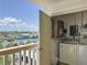 Open lanai with washer, dryer, and serene views of the surrounding water at 1100 Tarpon Center Dr # 503 5C, Venice, FL 34285