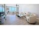 Bright living room with ocean view, modern furniture, and beachy decor creating a tranquil coastal atmosphere at 1100 Tarpon Center Dr # 503 5C, Venice, FL 34285
