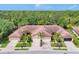 A high angle view of homes showcasing lush landscaping and beautiful tiled roofs at 11103 Batello Dr, Venice, FL 34292
