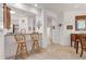 Bright breakfast bar with an open concept view to the kitchen at 11103 Batello Dr, Venice, FL 34292