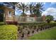 Entrance to Venetian Falls with lush landscaping, trees, and elegant community signage at 11103 Batello Dr, Venice, FL 34292