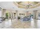 Spacious lobby featuring neutral tones, tile floors, comfortable seating, and outdoor views at 11103 Batello Dr, Venice, FL 34292
