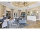 Elegant lobby with tile flooring, decorative chandelier, and comfortable seating area near the pool entrance at 11103 Batello Dr, Venice, FL 34292