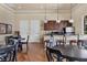 Cozy lounge area with wood floors, coffee bar, comfortable seating, and a relaxed atmosphere at 11103 Batello Dr, Venice, FL 34292