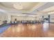 Expansive meeting room features hardwood floors, elegant lighting, and ample seating for large gatherings at 11103 Batello Dr, Venice, FL 34292