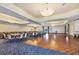 Spacious meeting room featuring tables, chairs, a dance floor, and stylish lighting fixtures at 11103 Batello Dr, Venice, FL 34292