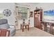 Comfortable office nook with a window view, a cozy chair, and ample storage space at 11103 Batello Dr, Venice, FL 34292